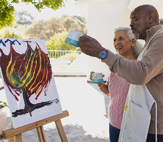 Man and woman painting a canvas at Art House Pasadena